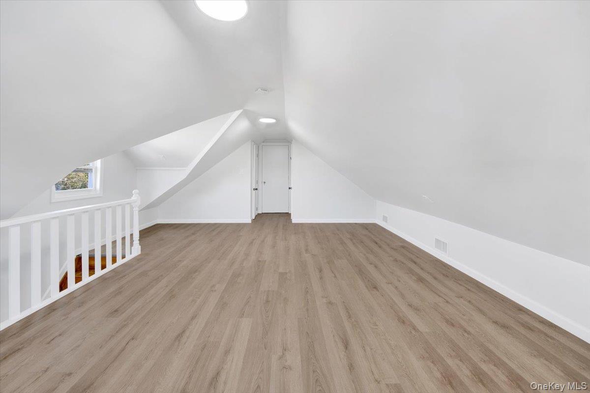 4626 Richardson Avenue, Unit 2 Bronx, NY 10470 - Photo 19 of 20 a view of an empty room with wooden floor