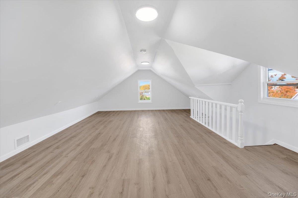 4626 Richardson Avenue, Unit 2 Bronx, NY 10470 - Photo 20 of 20 a view of an empty room with wooden floor