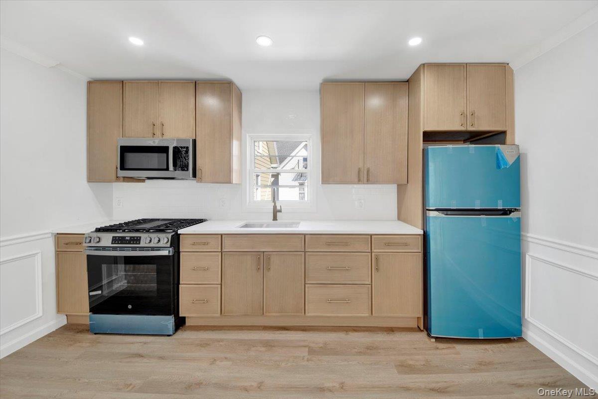 4626 Richardson Avenue, Unit 2 Bronx, NY 10470 - Photo 5 of 20 a kitchen with a refrigerator and a sink