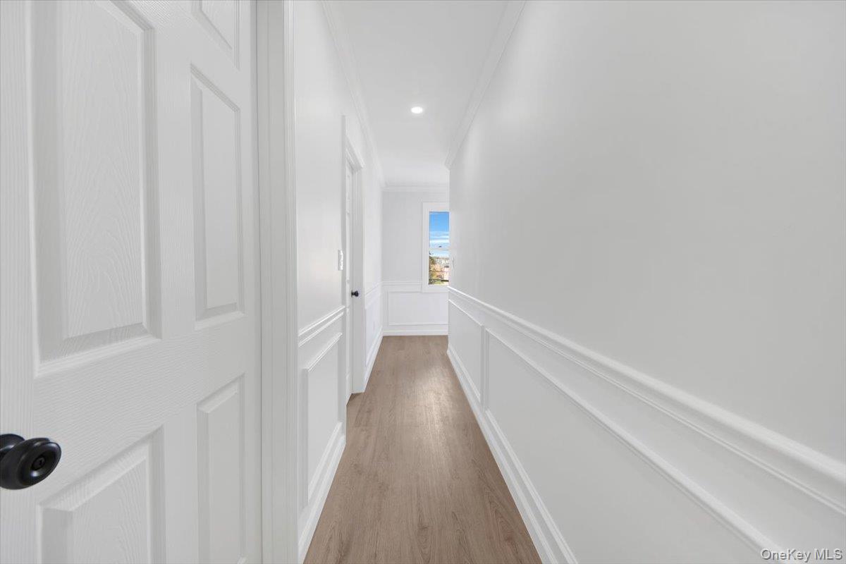 4626 Richardson Avenue, Unit 2 Bronx, NY 10470 - Photo 9 of 20 a view of a hallway with wooden floor