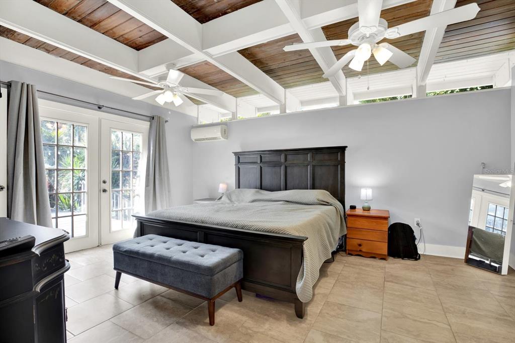 15656 1st Street East Redington Beach, FL 33708 - Photo 11 of 32 a bedroom with bed and window