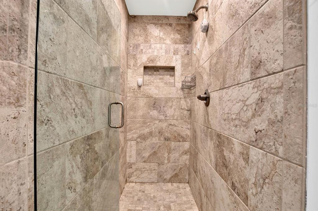 15656 1st Street East Redington Beach, FL 33708 - Photo 15 of 32 a bathroom with a shower