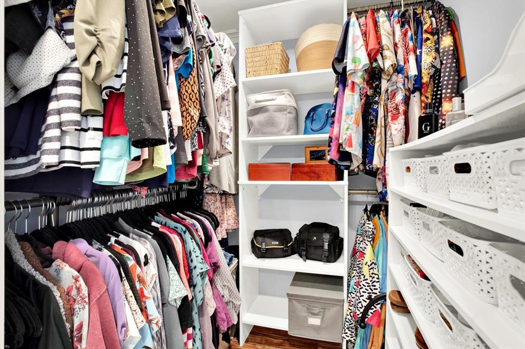 15656 1st Street East Redington Beach, FL 33708 - Photo 16 of 32 a view of walk in closet with clothes and shoes