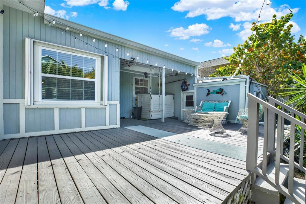 15656 1st Street East Redington Beach, FL 33708 - Photo 24 of 32 a view of a house with backyard and sitting area