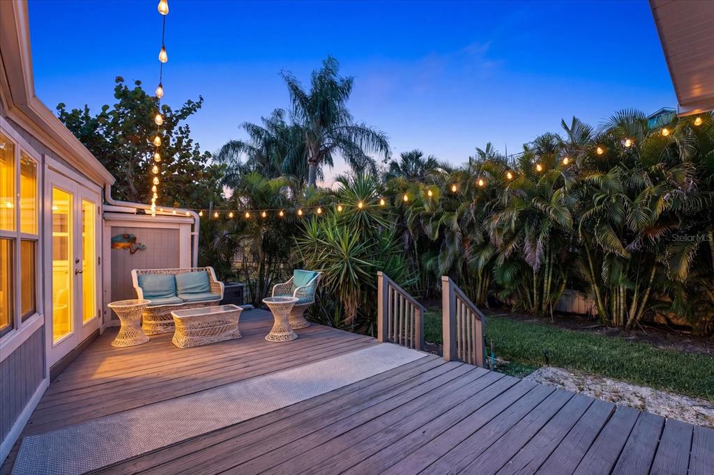 15656 1st Street East Redington Beach, FL 33708 - Photo 25 of 32 a view of a house with backyard and sitting area