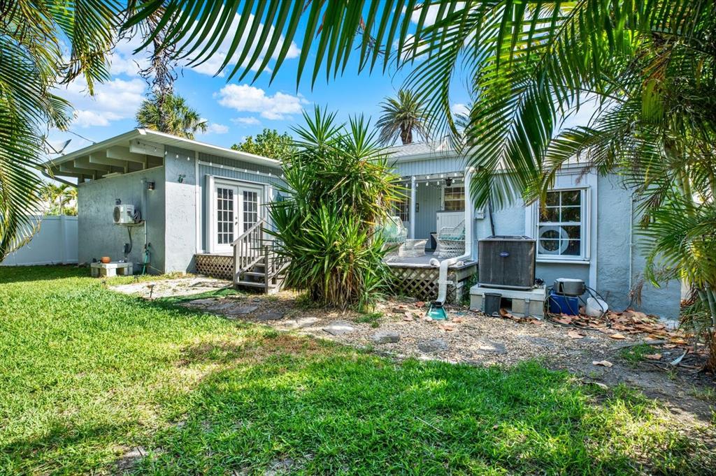 15656 1st Street East Redington Beach, FL 33708 - Photo 26 of 32 a view of a house with backyard and sitting area