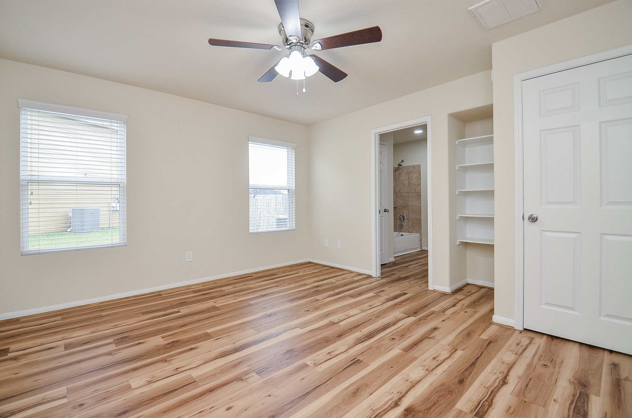 3010 Country Clearing Lane Rosenberg, TX 77471 - Photo 12 of 21 wooden floor in an empty room with a window