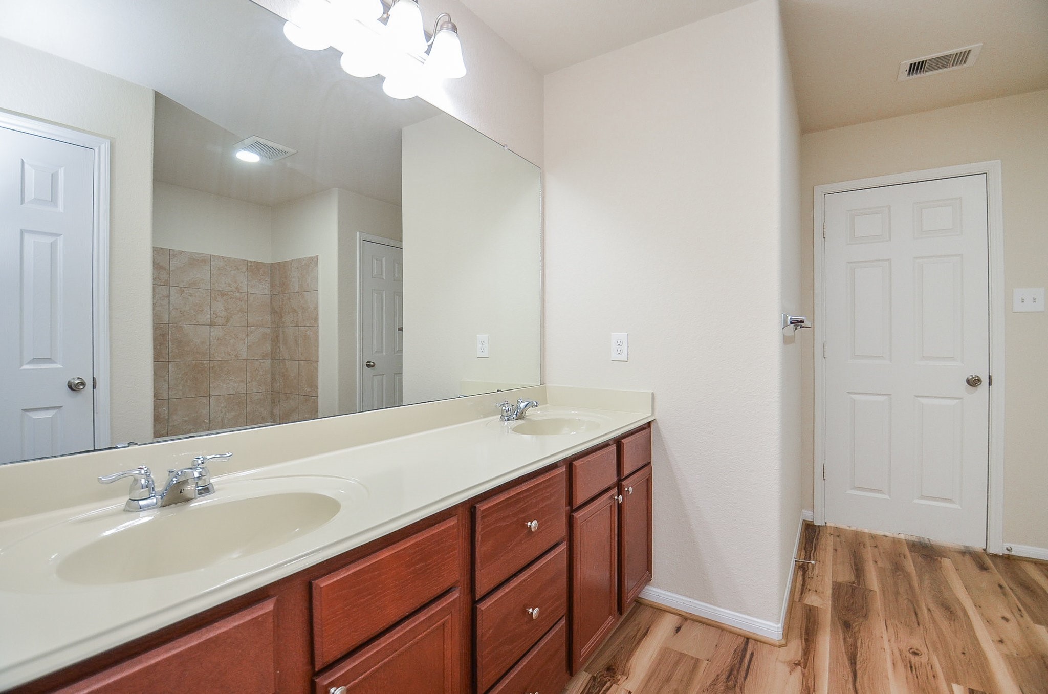 3010 Country Clearing Lane Rosenberg, TX 77471 - Photo 15 of 21 a bathroom with a sink a vanity and a mirror