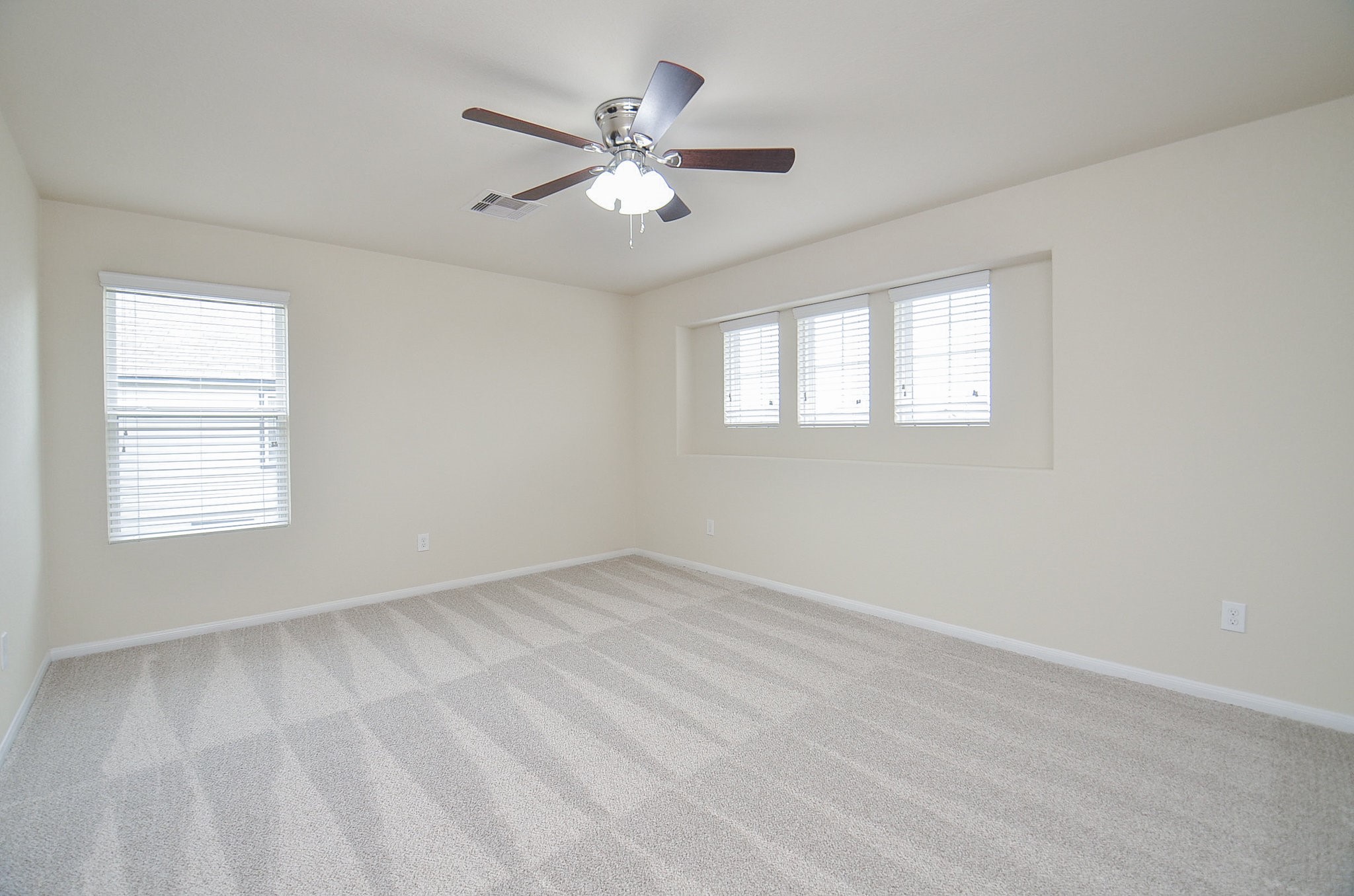 3010 Country Clearing Lane Rosenberg, TX 77471 - Photo 18 of 21 an empty room with windows and fan