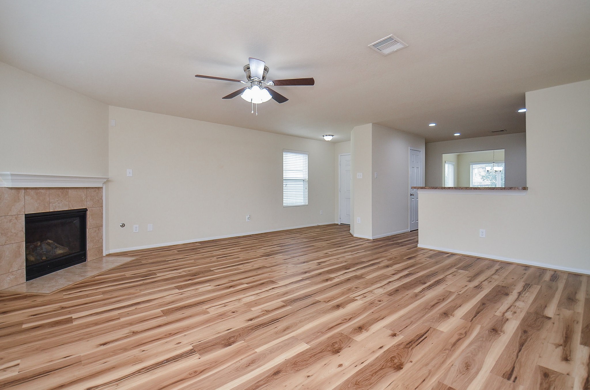 3010 Country Clearing Lane Rosenberg, TX 77471 - Photo 5 of 21 a view of empty room with wooden floor and fan
