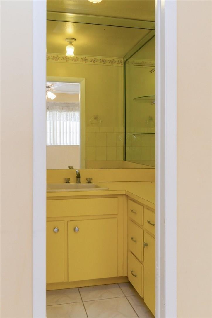 3300 Southwest 94th Court Miami, FL 33165 - Photo 7 of 18 a bathroom with a sink and a mirror