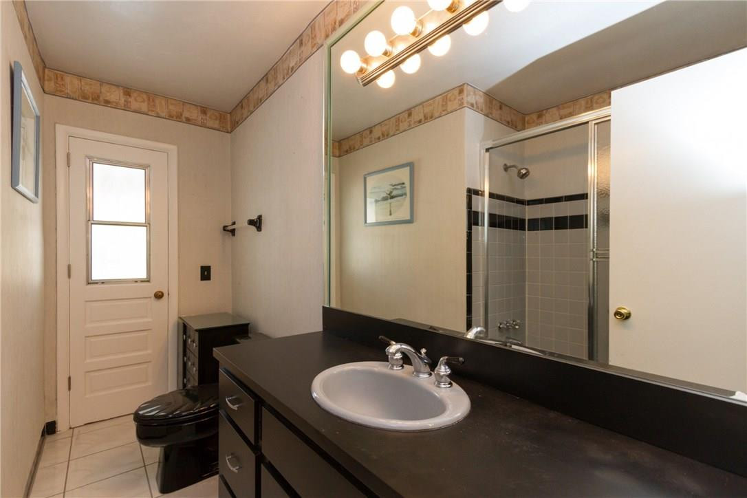 3300 Southwest 94th Court Miami, FL 33165 - Photo 9 of 18 a bathroom with a sink and a mirror