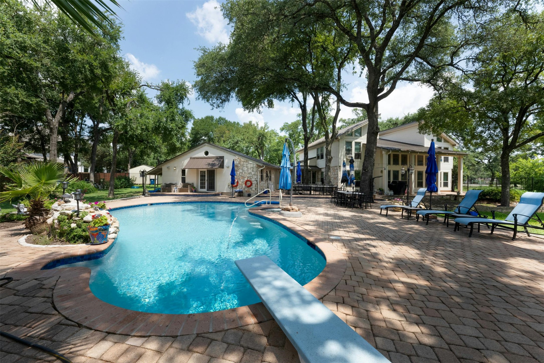 9911 Anderson Mill Road Austin, TX 78750 - Photo 20 of 29 A spacious backyard with an inviting pool, ideal for outdoor gatherings and relaxation.