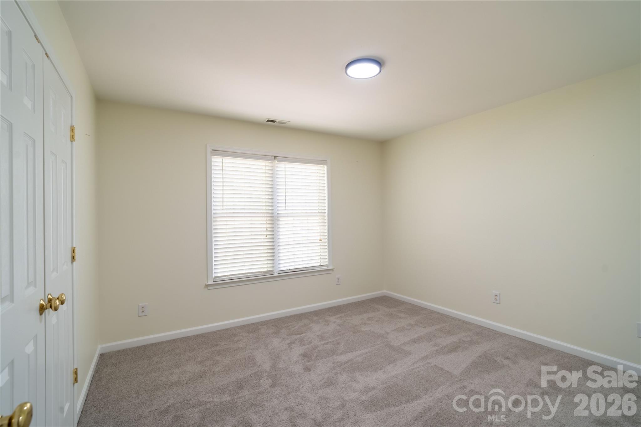 16905 Laureate Road, Unit 16 Huntersville, NC 28078 - Photo 35 of 38 an empty room with a window
