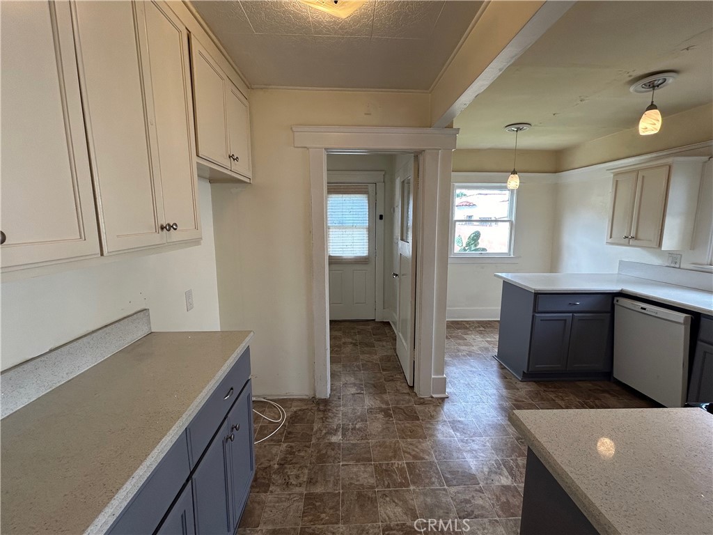 2285 Pine Avenue Long Beach, CA 90806 - Photo 16 of 25 a view of a kitchen with cabinets