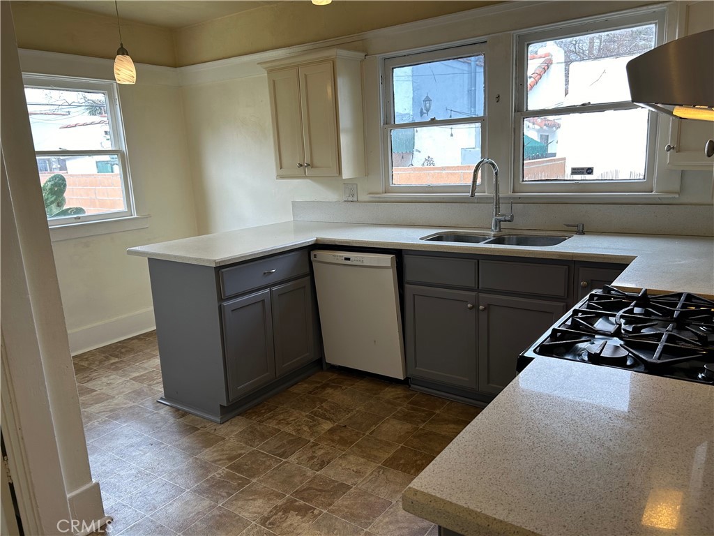 2285 Pine Avenue Long Beach, CA 90806 - Photo 17 of 25 a kitchen with stainless steel appliances a sink stove and window