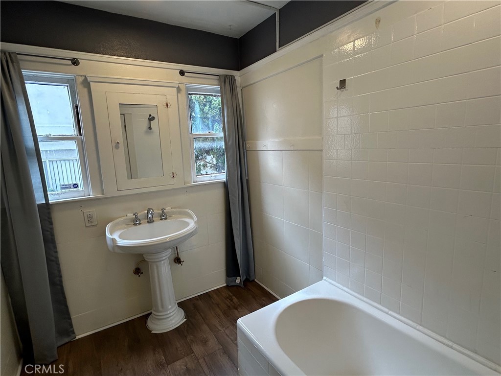 2285 Pine Avenue Long Beach, CA 90806 - Photo 22 of 25 a bathroom with a sink toilet and shower