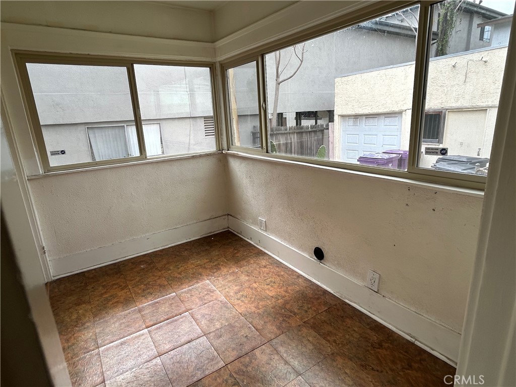 2285 Pine Avenue Long Beach, CA 90806 - Photo 24 of 25 a view of a kitchen with wooden floor and a window