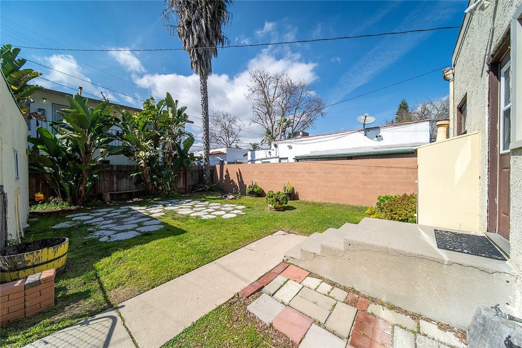 2285 Pine Avenue Long Beach, CA 90806 - Photo 7 of 25 a front view of a house with garden