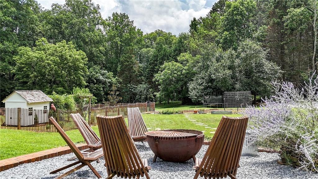 548 Tamarack Trail Canton, GA 30115 - Photo 20 of 83 a view of a backyard with swimming pool and furniture