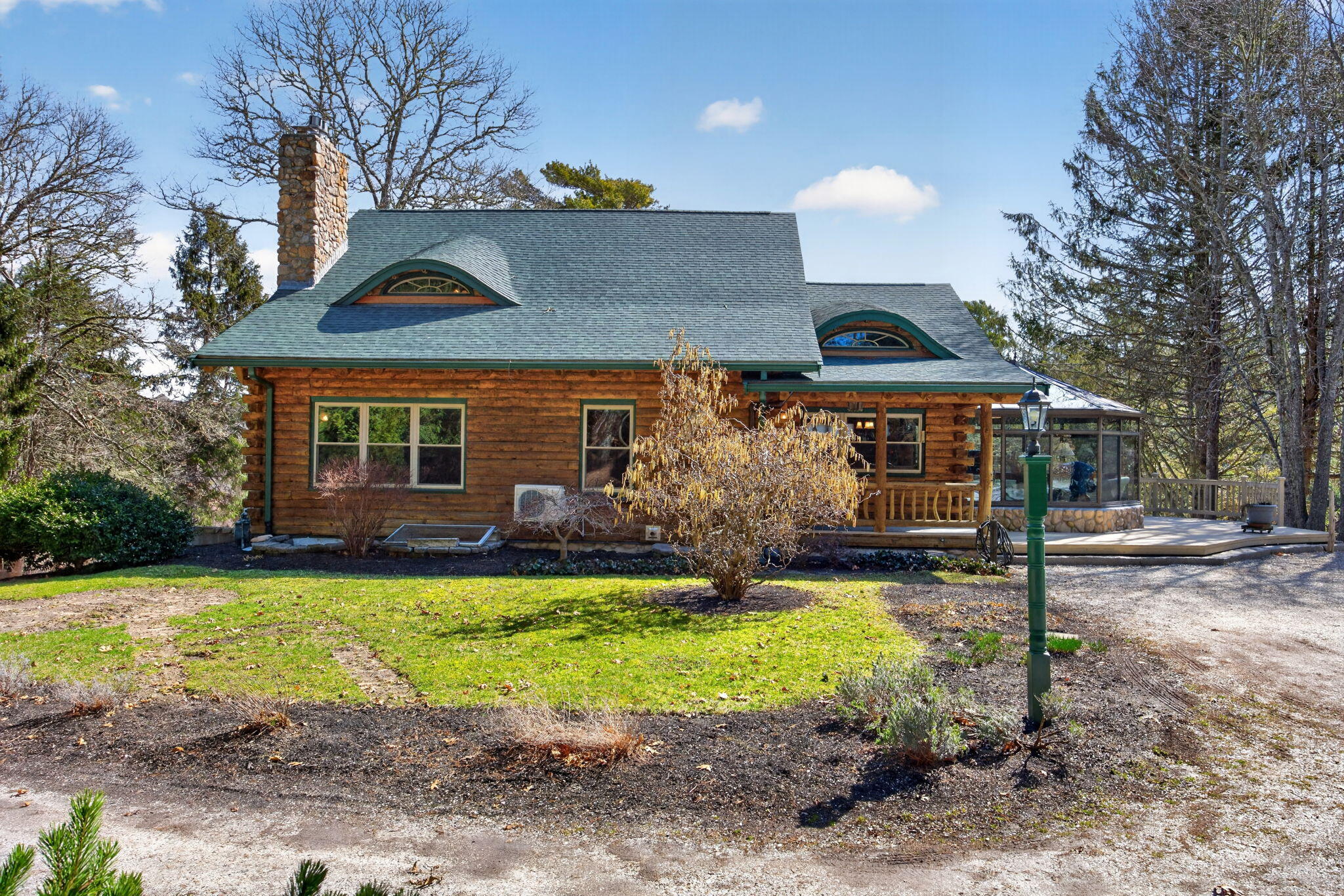 73 County Road Bourne, MA 02532 - Photo 2 of 91 a front view of a house with a yard and garage