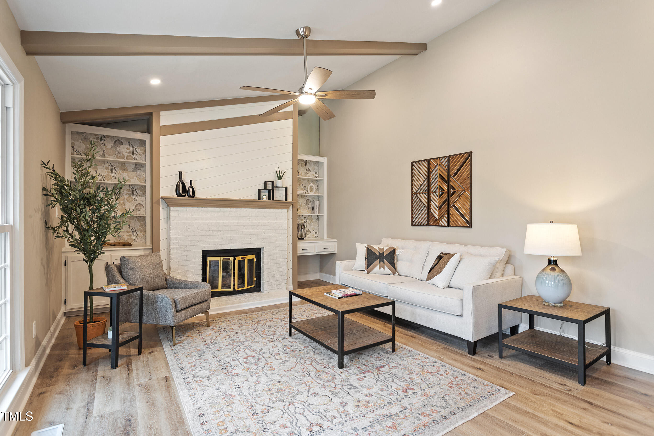 7825 Breckon Way Raleigh, NC 27615 - Photo 13 of 32 a living room with furniture and a fireplace