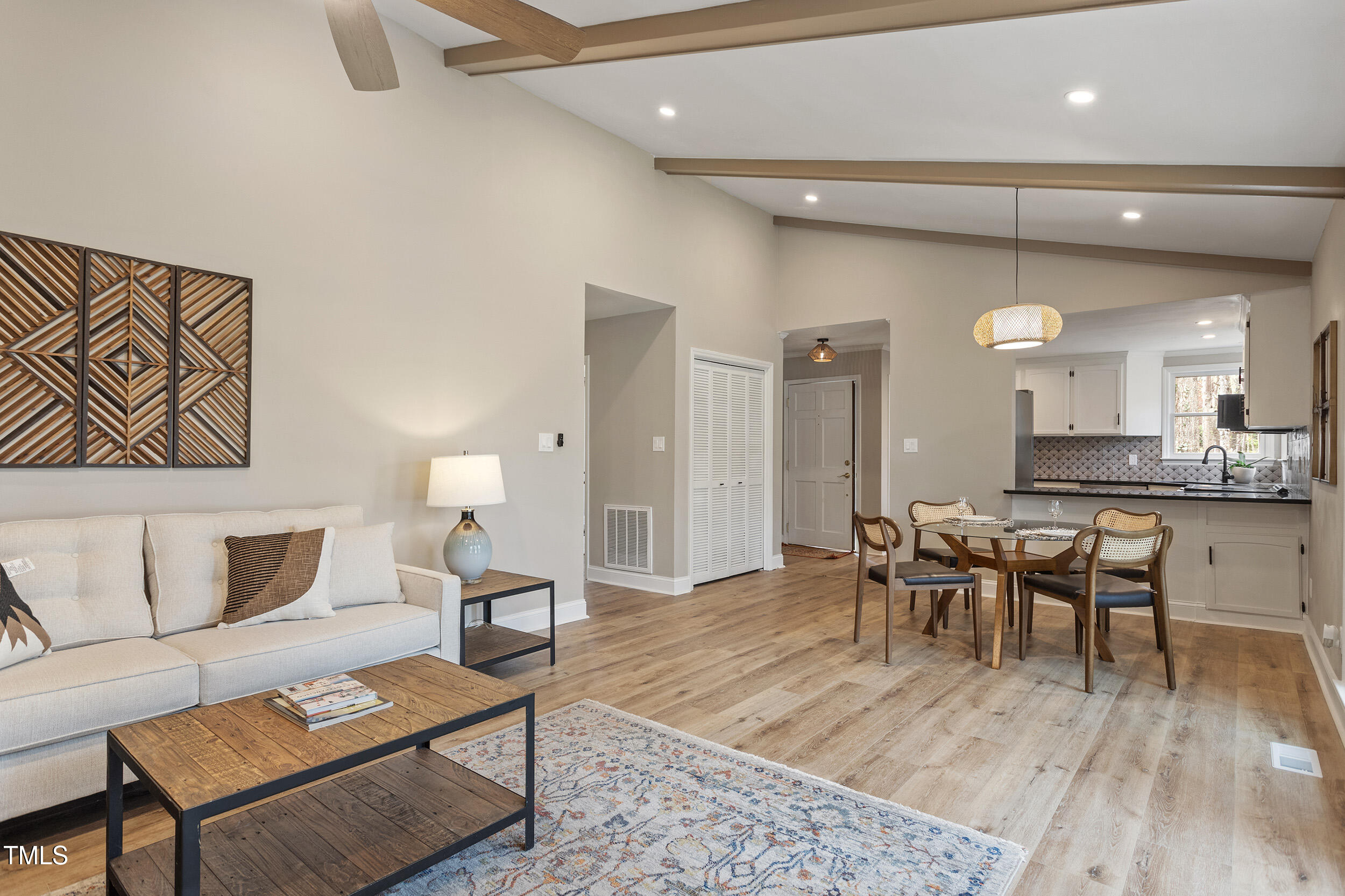 7825 Breckon Way Raleigh, NC 27615 - Photo 15 of 32 a living room with furniture and wooden floor