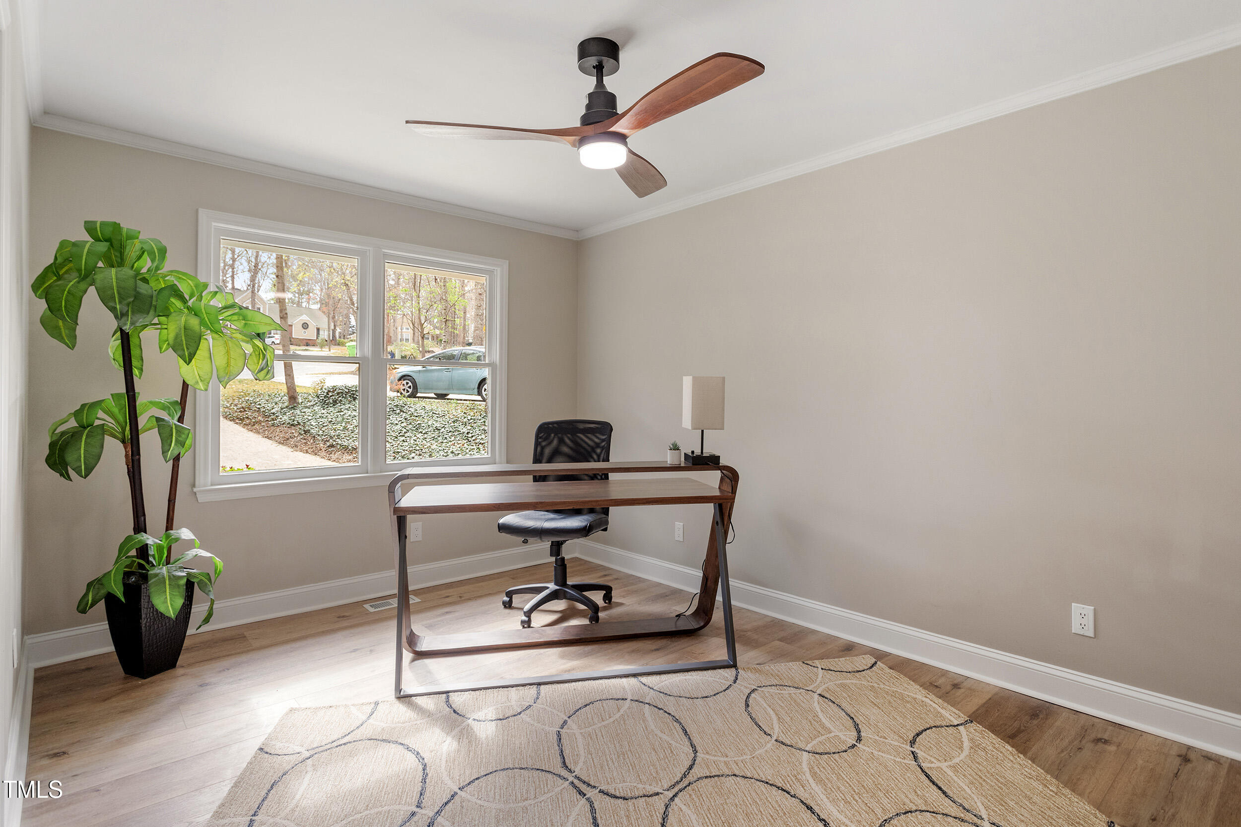 7825 Breckon Way Raleigh, NC 27615 - Photo 16 of 32 a view of a workspace with furniture and a window
