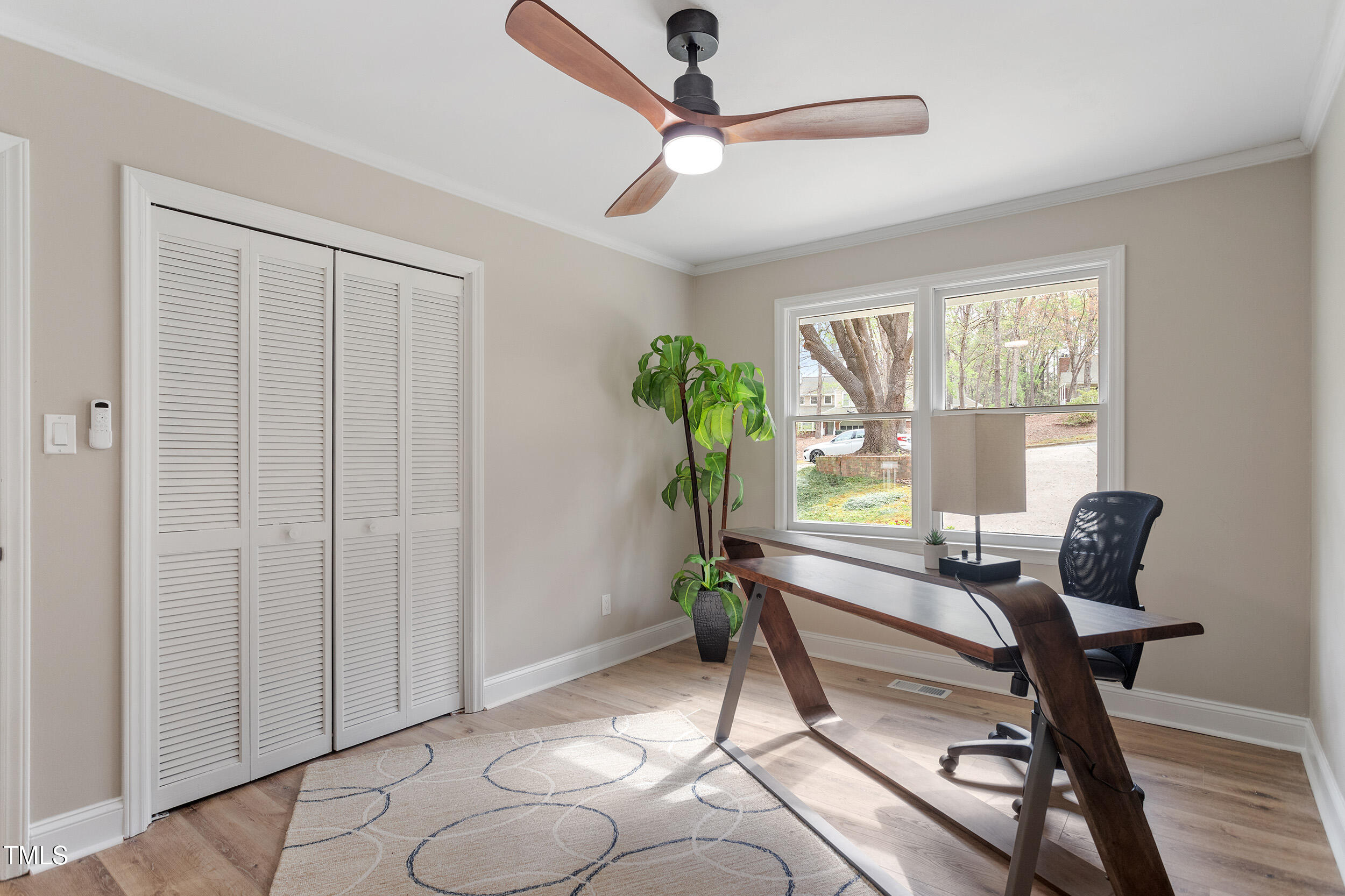7825 Breckon Way Raleigh, NC 27615 - Photo 17 of 32 a living room with furniture and a window