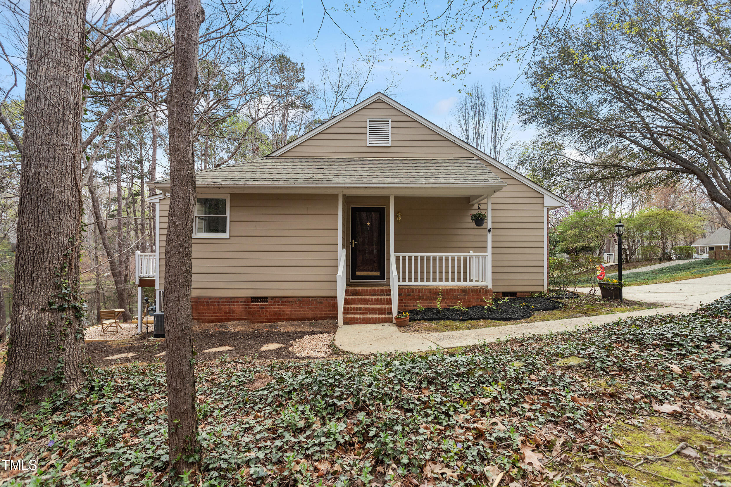7825 Breckon Way Raleigh, NC 27615 - Photo 25 of 32 a front view of a house with a yard