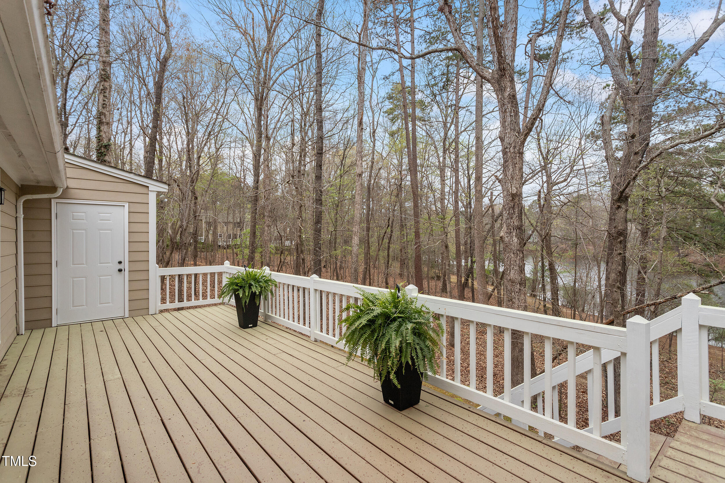 7825 Breckon Way Raleigh, NC 27615 - Photo 28 of 32 a view of balcony with deck and wooden floor