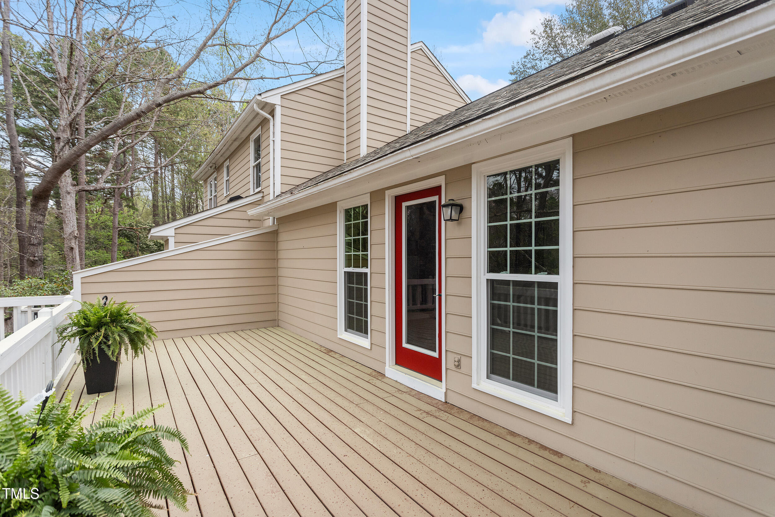 7825 Breckon Way Raleigh, NC 27615 - Photo 29 of 32 a view of a house with a door and wooden floor