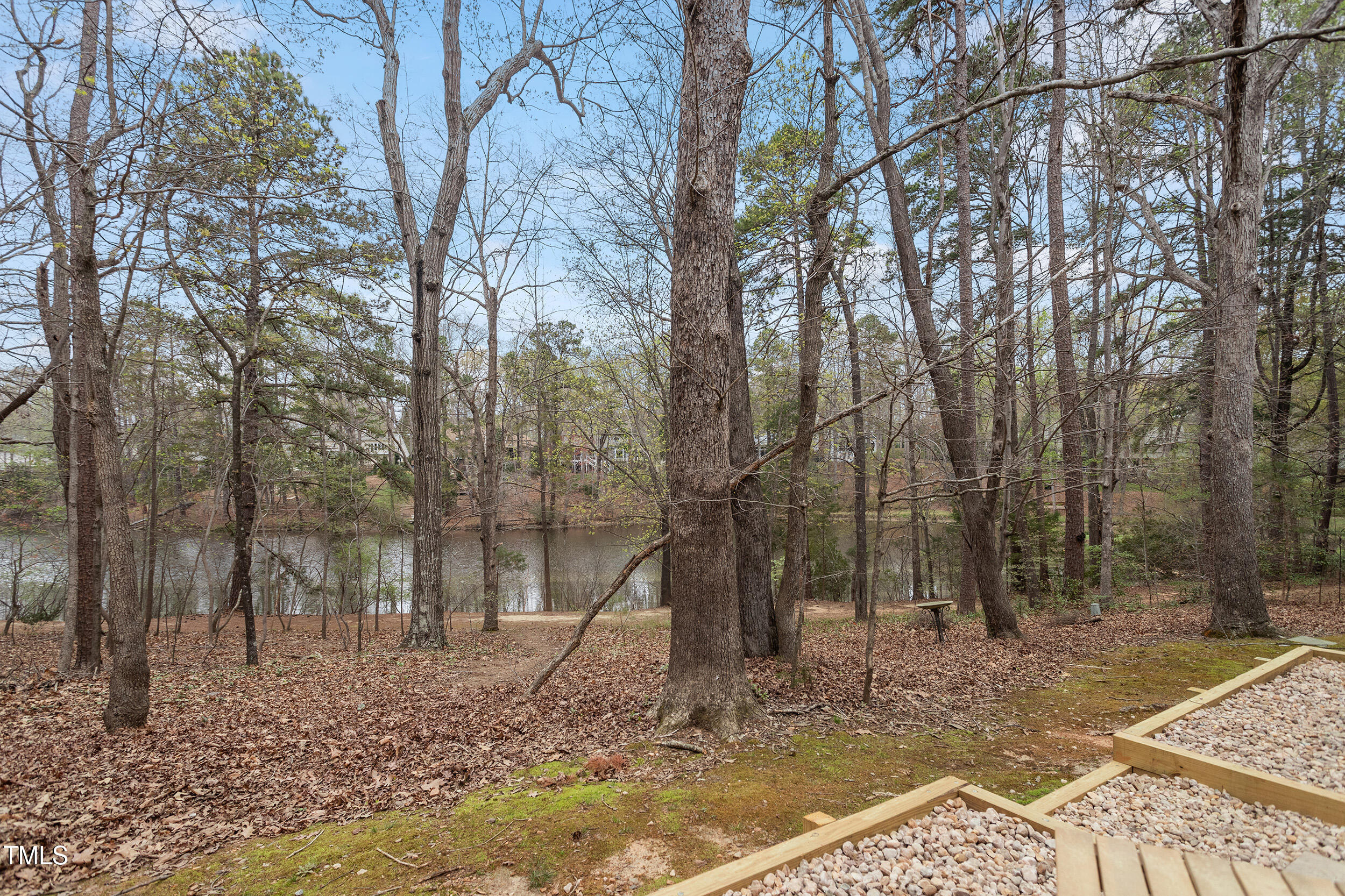 7825 Breckon Way Raleigh, NC 27615 - Photo 2 of 32 a backyard of a house with lots of green space
