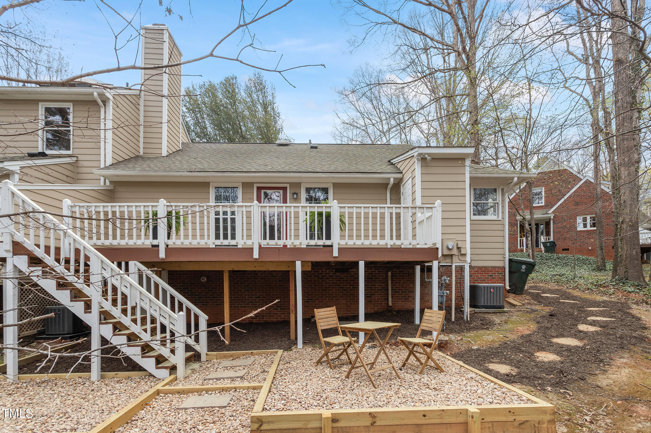 7825 Breckon Way Raleigh, NC 27615 - Photo 31 of 32 a view of a house with a patio and a yard
