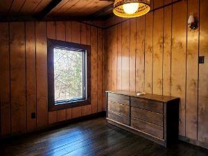 63 Ross Hollow Road New Kensington, PA 15068 - Photo 15 of 15 a view of an empty room with wooden floor and a window