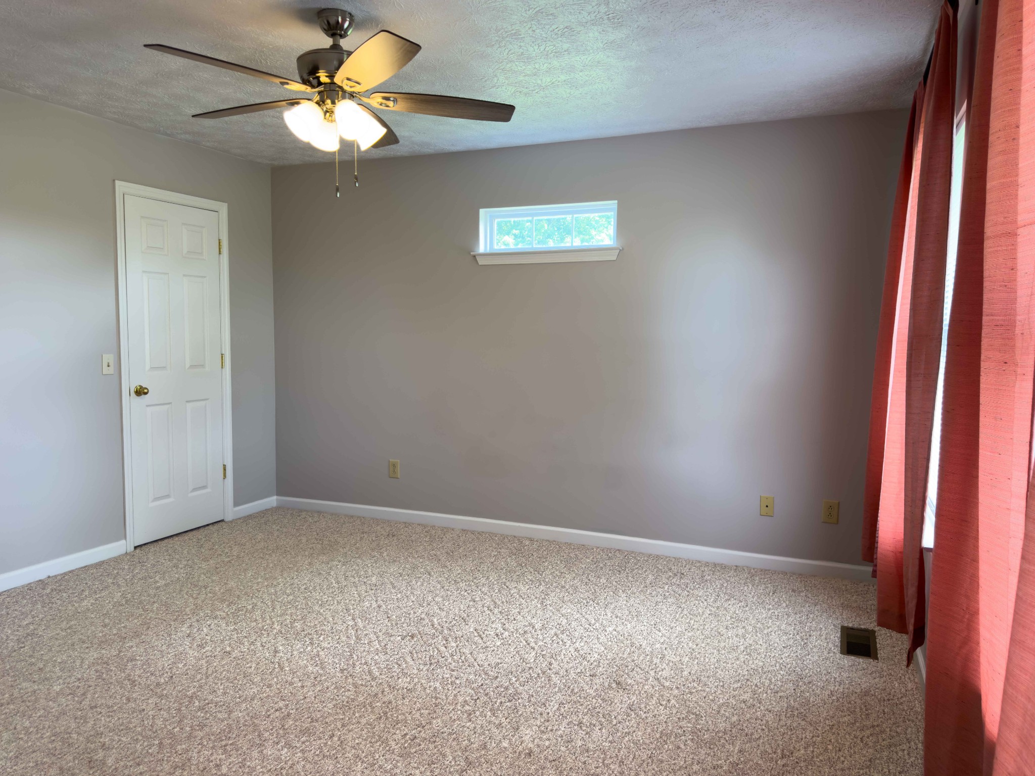 618 Lear Road Portland, TN 37148 - Photo 19 of 29 an empty room with windows and fan
