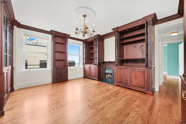 a view of kitchen with cabinets and wooden floor