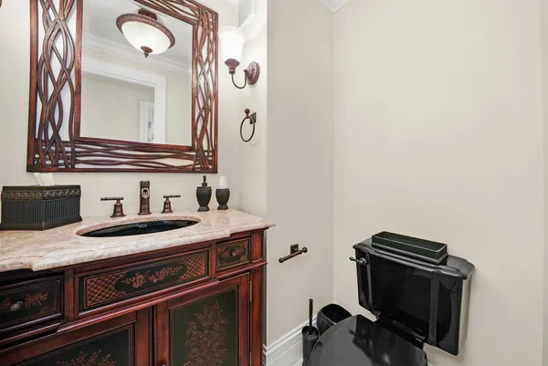 a bedroom with a bed and a wooden floor