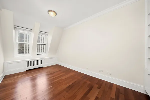 a view of staircase with white walls and a window