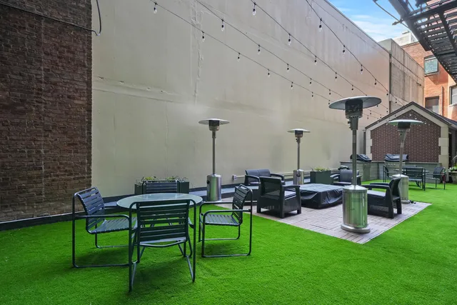 a view of a patio with couches chairs and a table