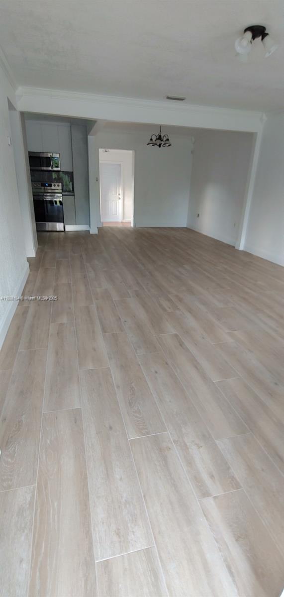 5770 Southwest 62nd Terrace Miami, FL 33143 - Photo 13 of 17 a view of an empty room with a window