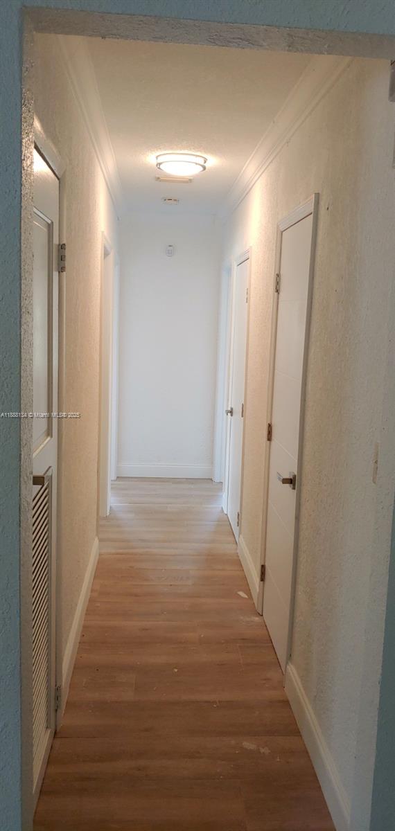 5770 Southwest 62nd Terrace Miami, FL 33143 - Photo 14 of 17 a view of a hallway with wooden floor
