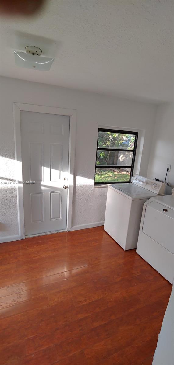5770 Southwest 62nd Terrace Miami, FL 33143 - Photo 16 of 17 a view of a bedroom with window and a kitchen