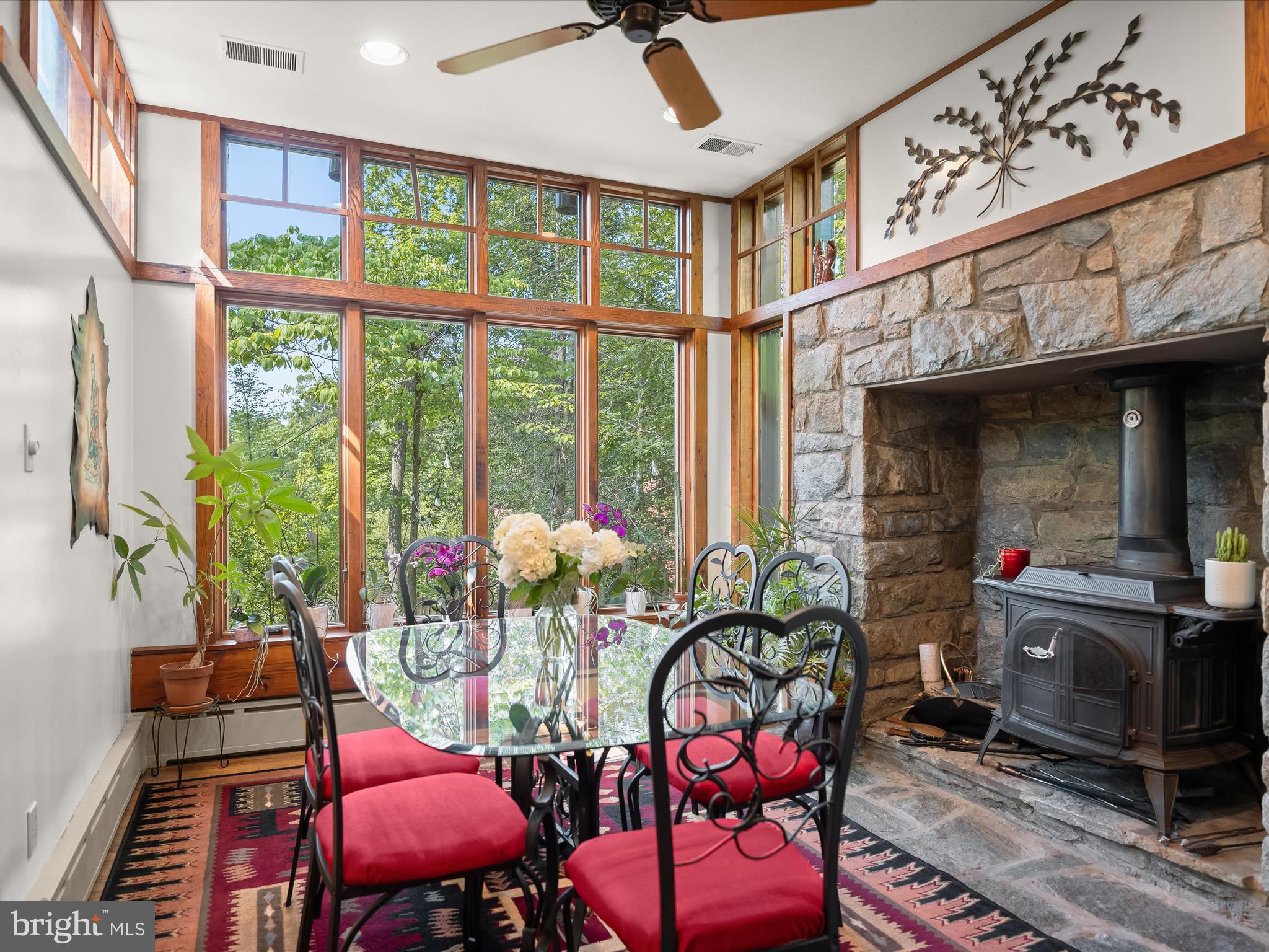 6310 Poe Road Bethesda, MD 20817 - Photo 14 of 46 Oversized windows & wood-burning stove