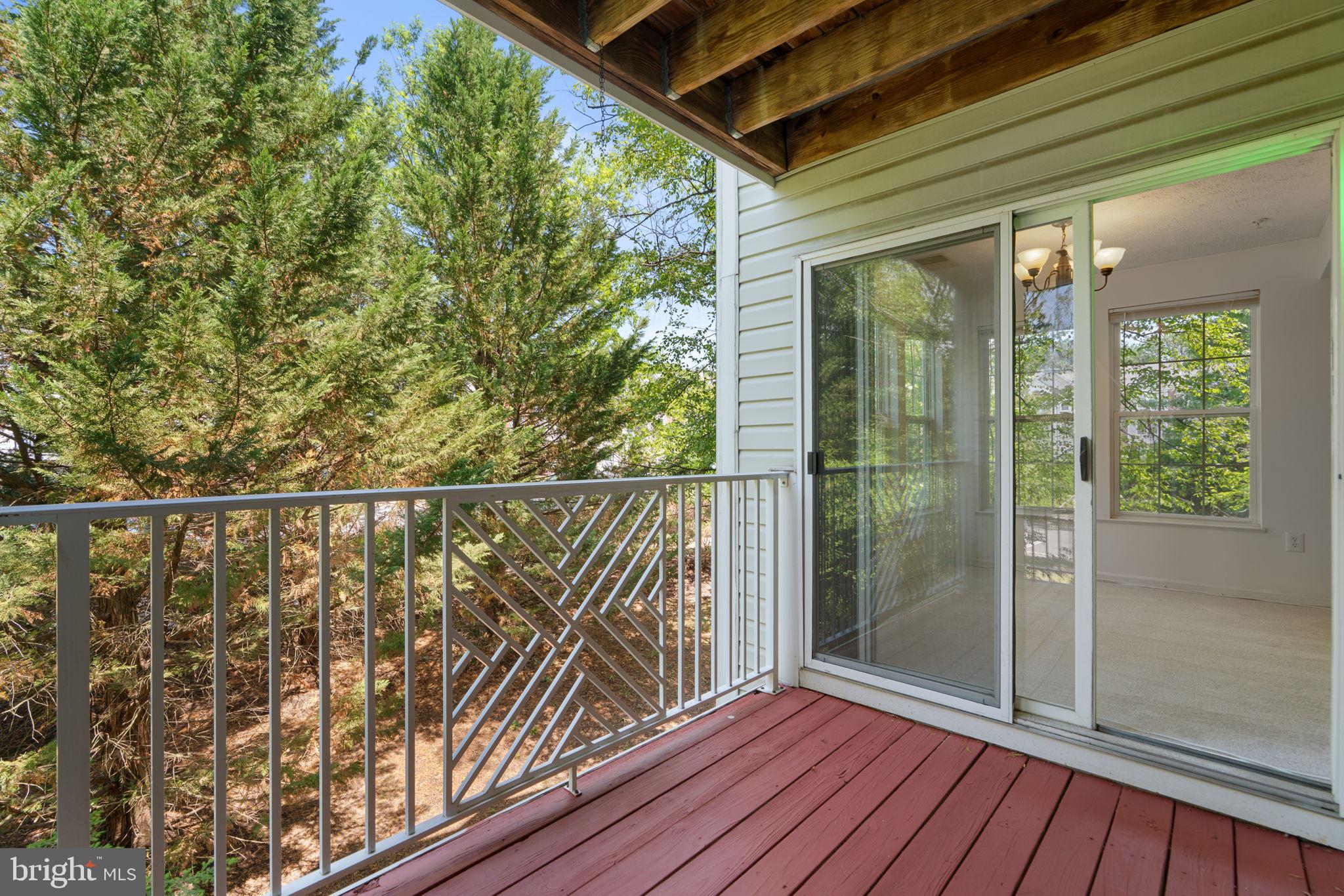2444 Blue Spring Court, Unit 203 Odenton, MD 21113 - Photo 29 of 36 a view of balcony with wooden floor