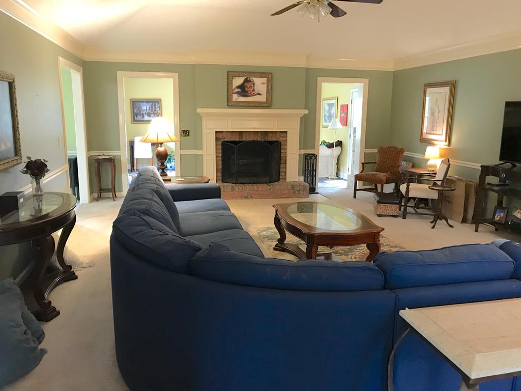 9802 County Line Road Midland, GA 31820 - Photo 2 of 15 a living room with furniture and a fireplace