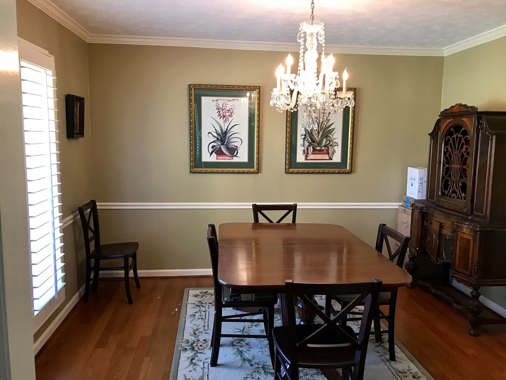 9802 County Line Road Midland, GA 31820 - Photo 5 of 15 a view of a dining room with furniture and a chandelier