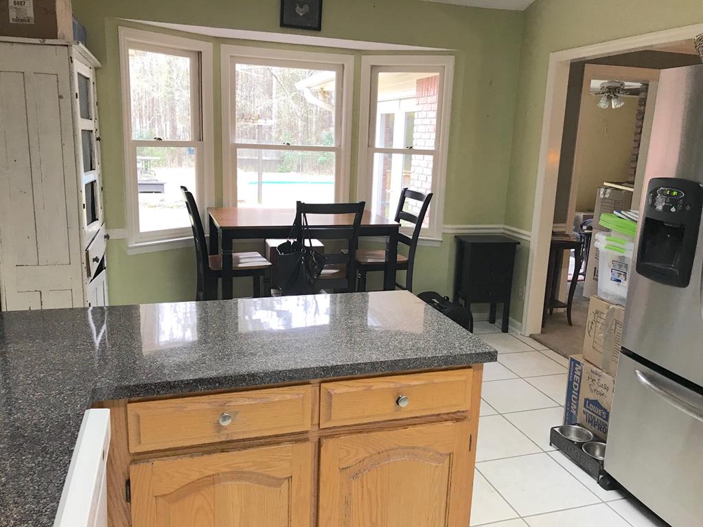 9802 County Line Road Midland, GA 31820 - Photo 6 of 15 a view of a kitchen counter top space cabinets and furniture