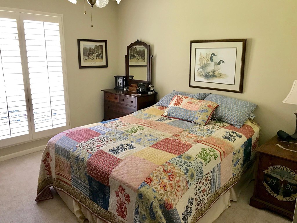 9802 County Line Road Midland, GA 31820 - Photo 7 of 15 a bedroom with a bed and a painting on the wall
