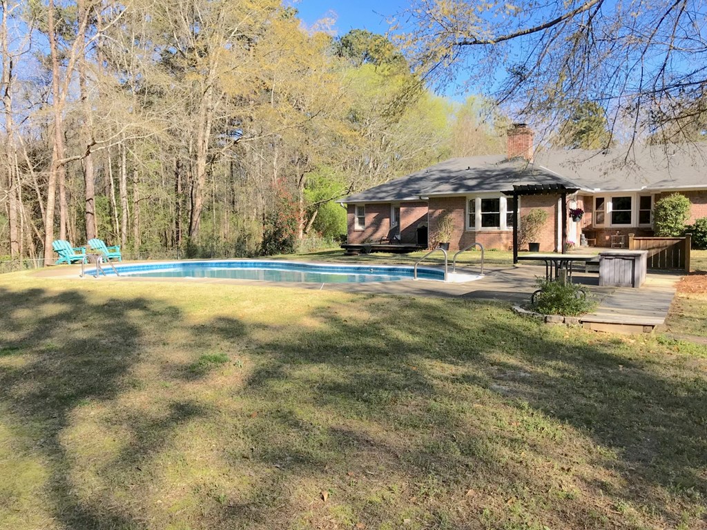 9802 County Line Road Midland, GA 31820 - Photo 10 of 15 a front view of a house with a yard